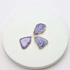 Polished purple druzy geode connectors framed in gold for custom accessories