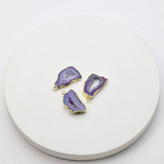 Vibrant purple druzy geode slice connectors with gold accents for crafting jewelry pieces