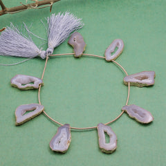 Stylish Pink Geode Necklace with Gold Frame and Tassel Details