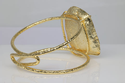 Statement bracelet with natural grey druzy geode set in gold.