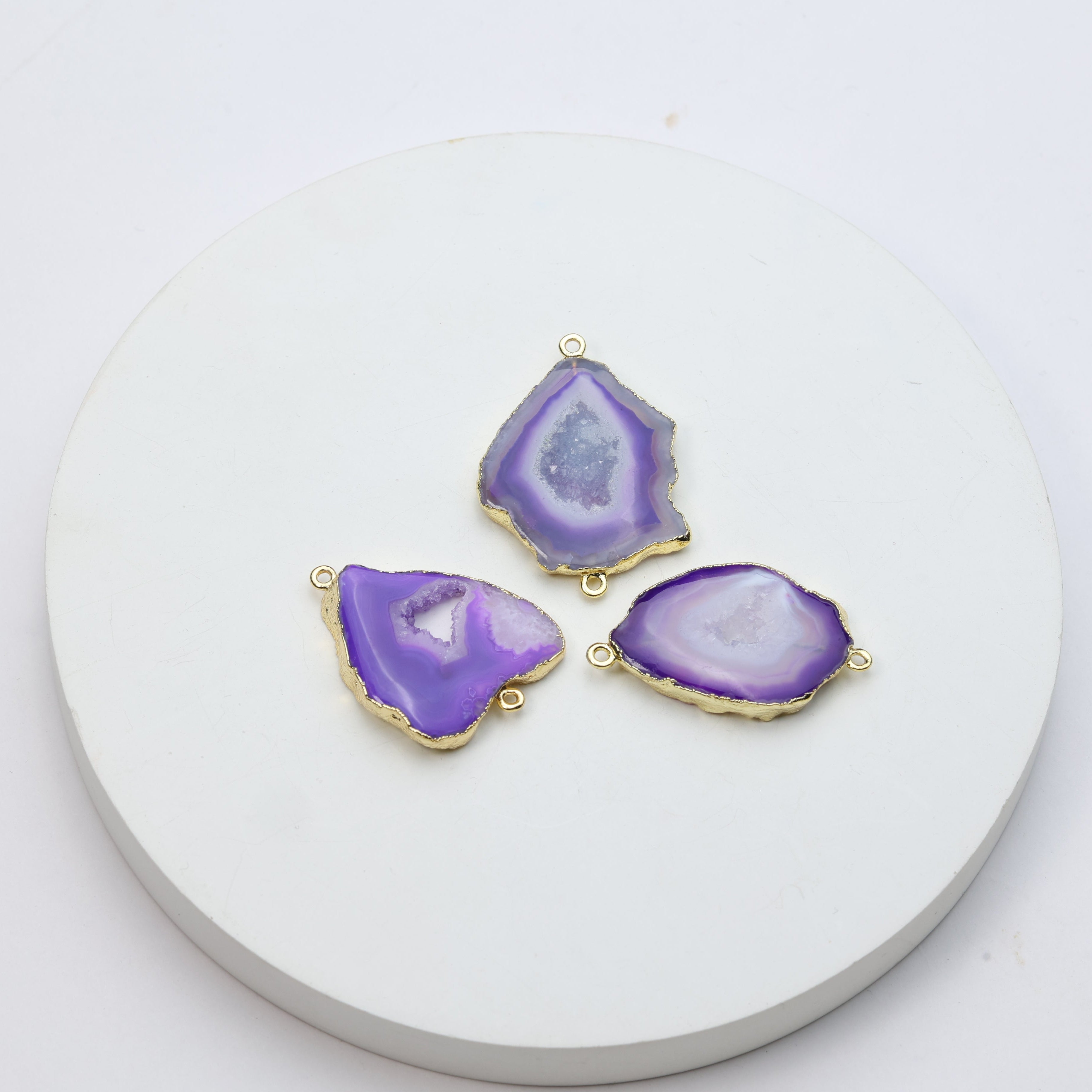 Organic-shaped purple geode slice charms with natural druzy crystals and connector loops