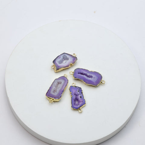 Purple druzy geode gemstone connectors featuring crystal interiors and gold edging