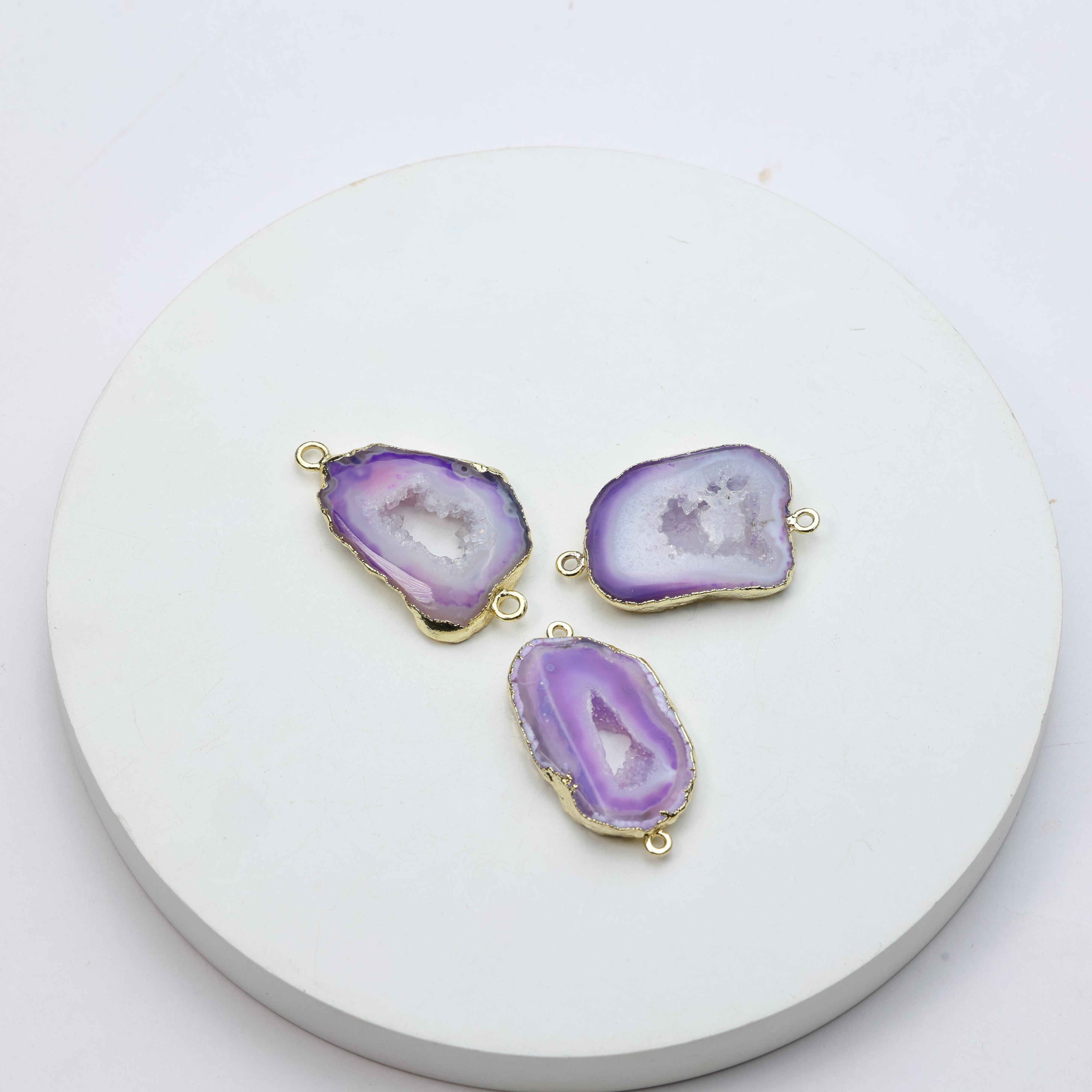 Vibrant purple druzy geode connectors bordered in gold plating for handmade accessories
