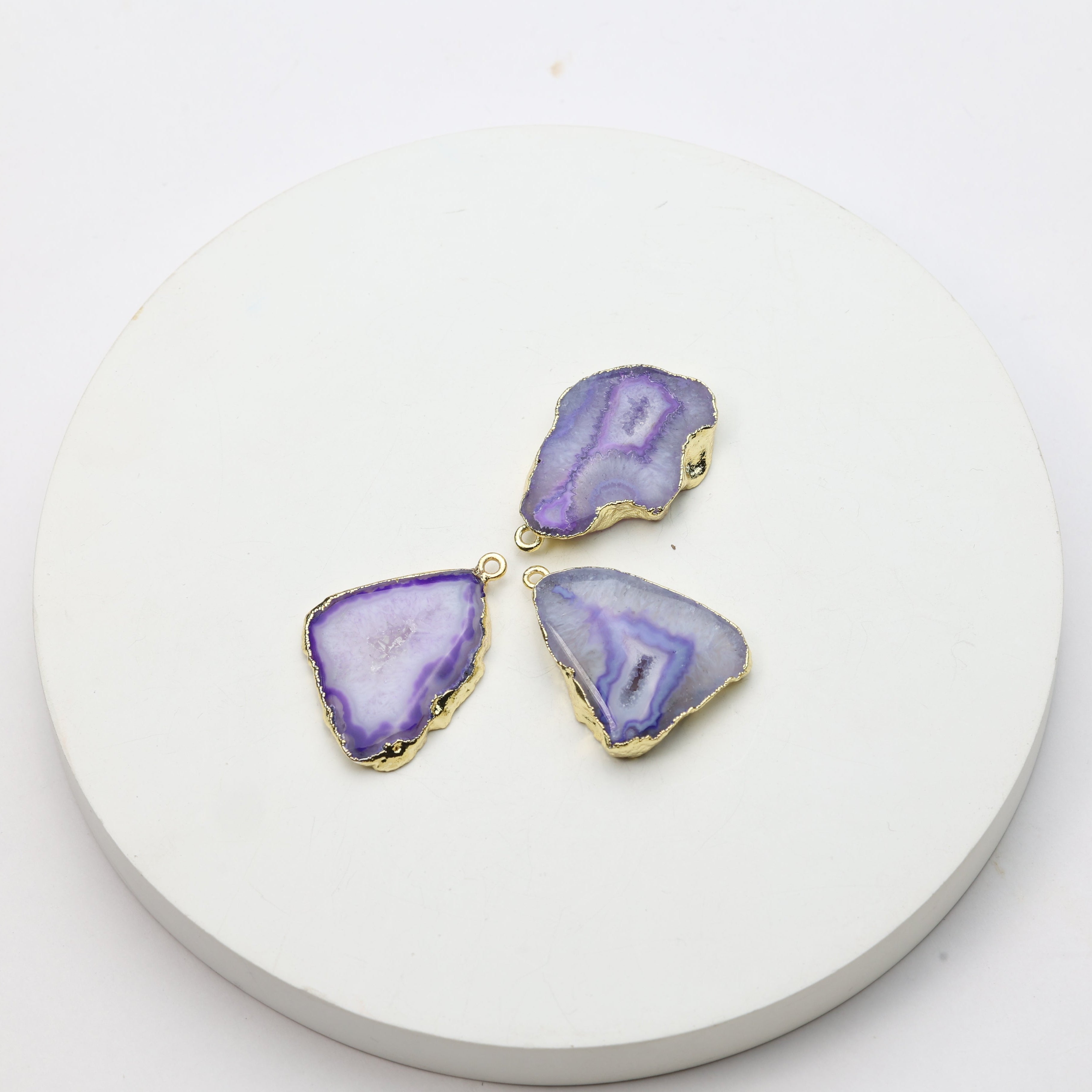 Polished purple druzy geode connectors framed in gold for custom accessories