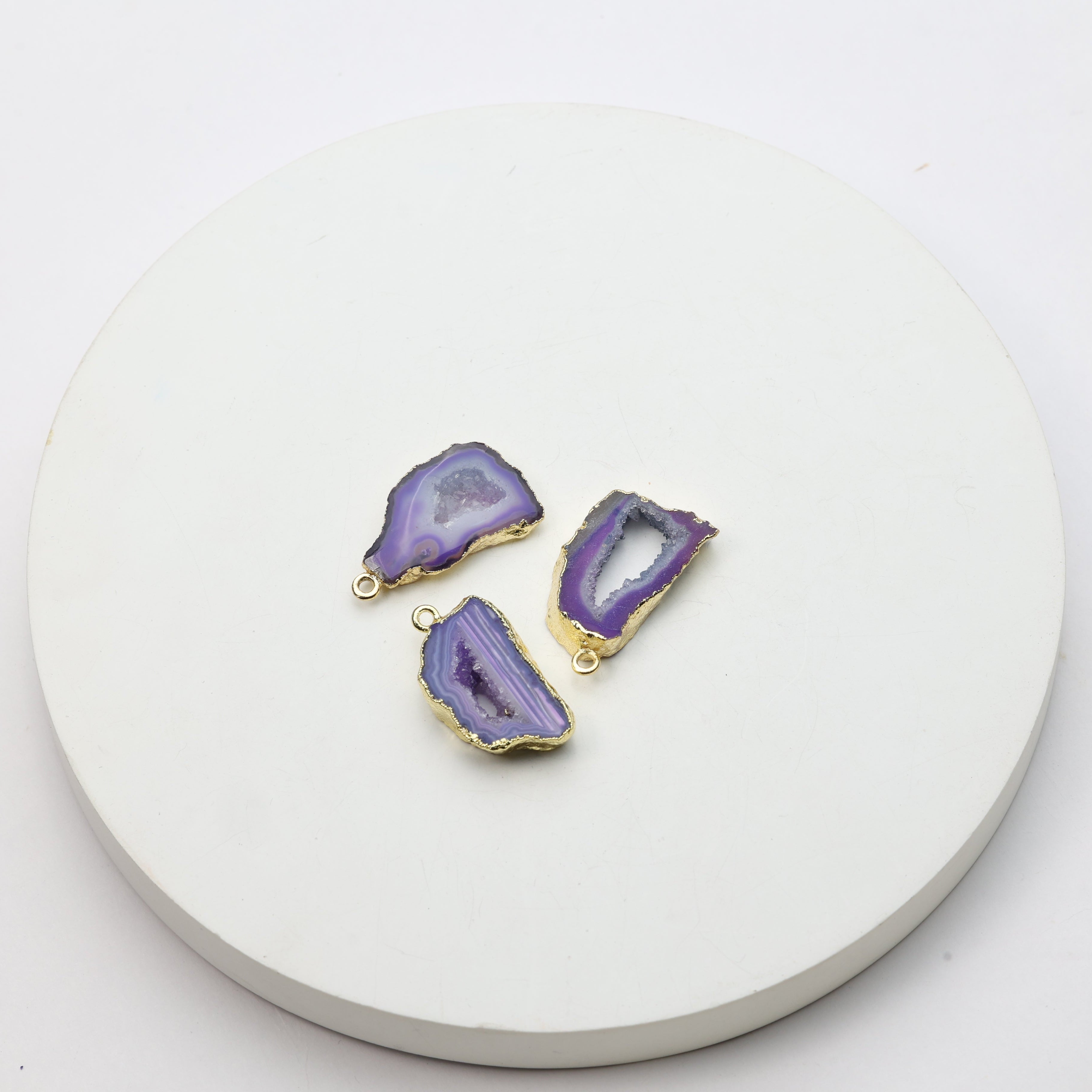 Vibrant purple druzy geode slice connectors with gold accents for crafting jewelry pieces