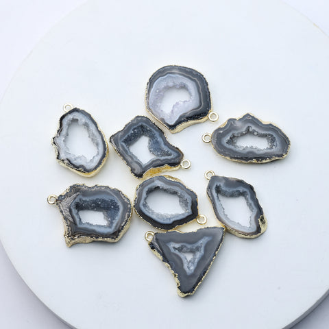 Grey agate geode druzy charms with gold-plated rims for DIY jewelry.
