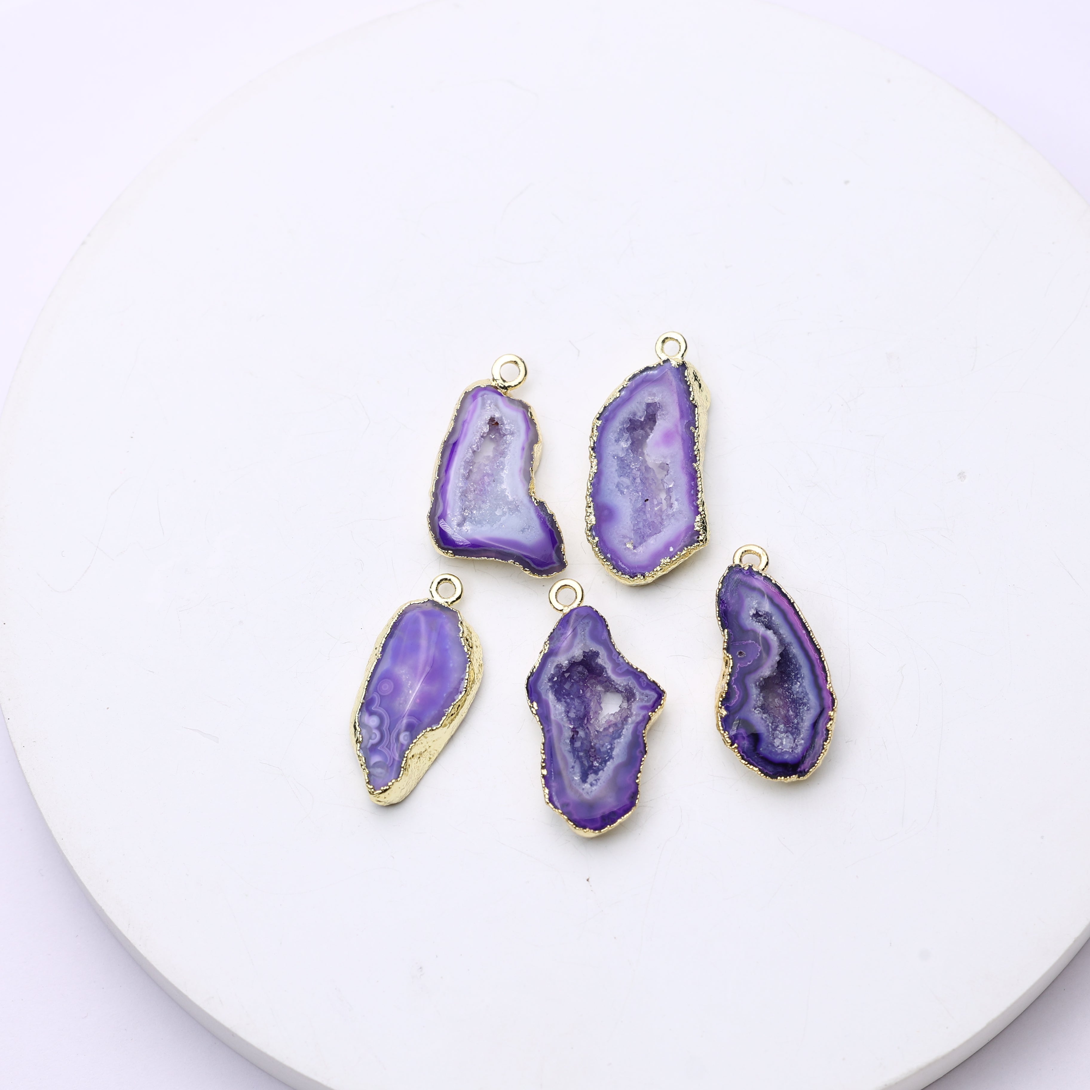 Purple crystal druzy geode charms outlined in gold for handmade jewelry projects