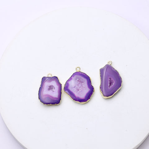 Artistic purple geode slice charms showcasing druzy crystals and gold detailing