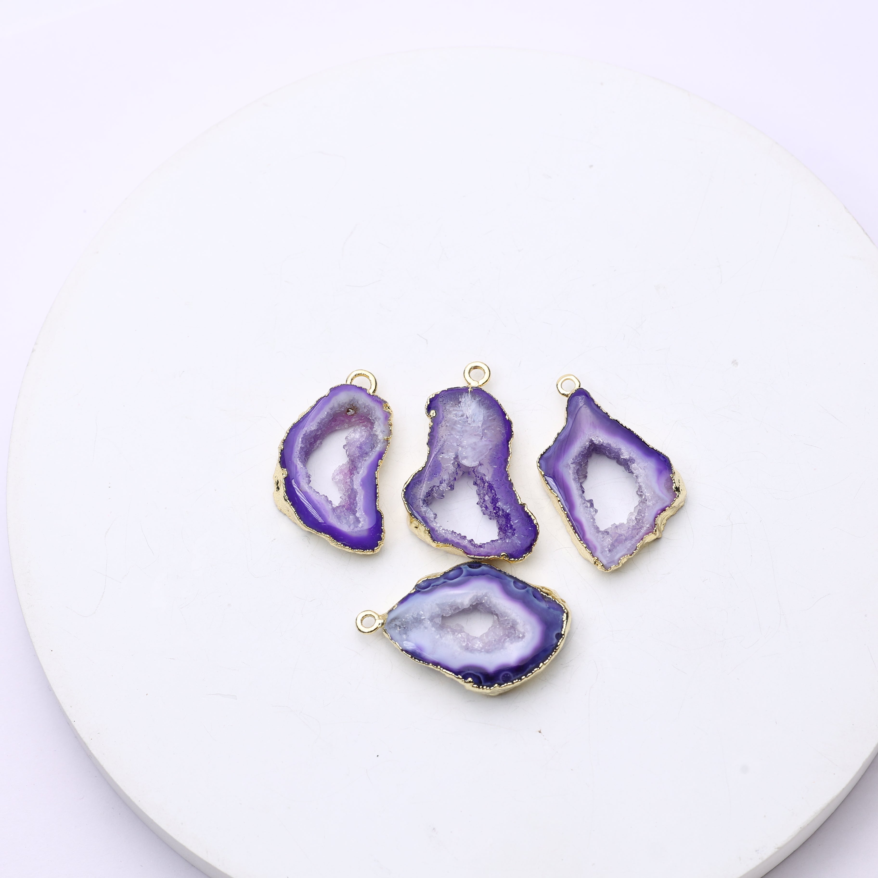 Long teardrop-style purple geode slice connectors with druzy centers and gold accents