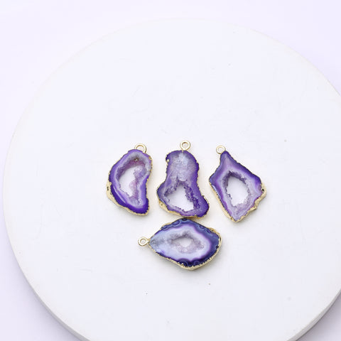 Long teardrop-style purple geode slice connectors with druzy centers and gold accents