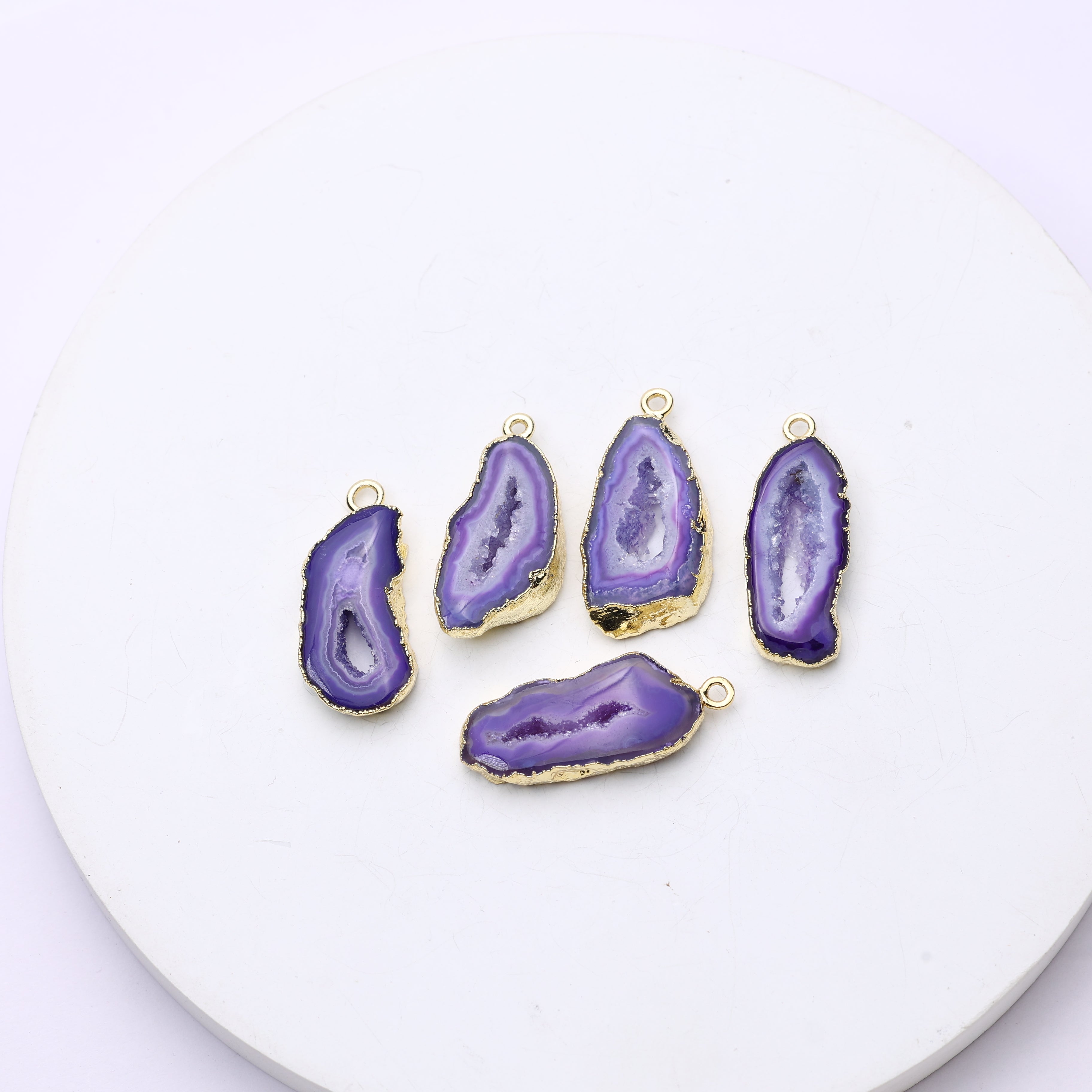 Glossy purple geode slice charms with natural druzy sparkle and gold-plated outlines