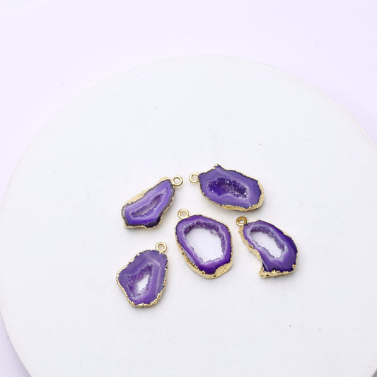Organic-shaped geode slice charm featuring raw druzy and connector loops