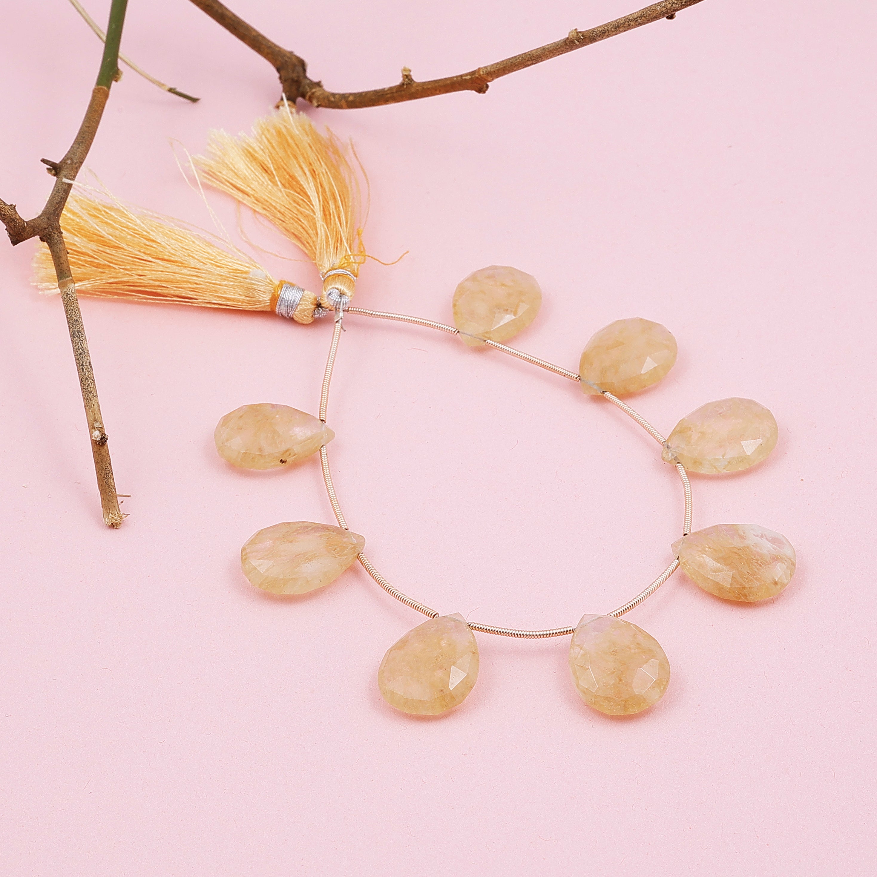 Golden rutile faceted drop beads used for DIY jewelry projects