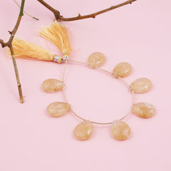 Golden rutile faceted drop beads used for DIY jewelry projects