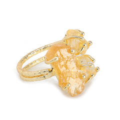 Designer gold-plated ring with natural rough gemstones in a triple-stone setting.
