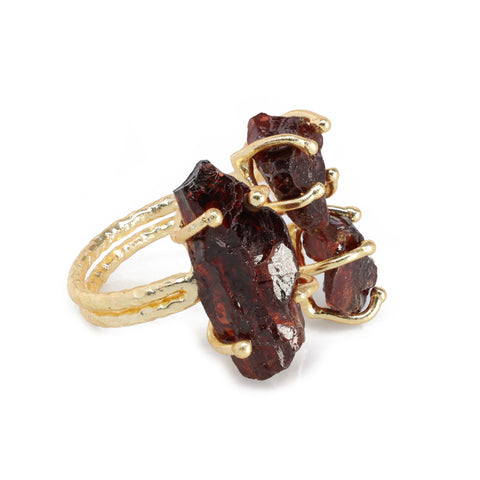 Unique handmade ring with three raw natural stones set in gold-plated metal.